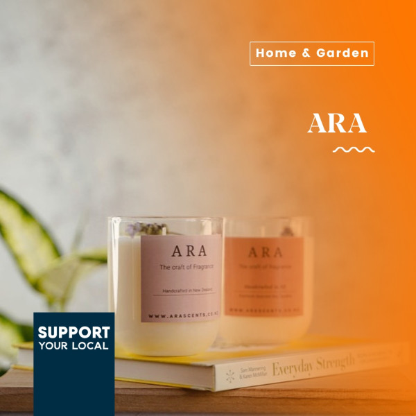 Ara Scents Homemade candles and plant in background